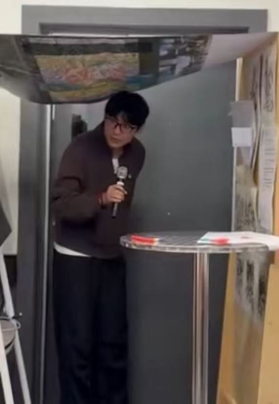 Apei Song speaking during a research presentation
